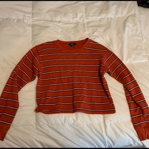 Cropped rust colored sweatshirt